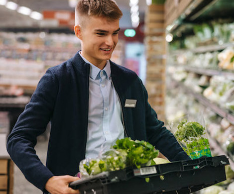 Young employee in the produce department.