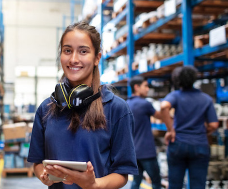 A young smiling warehouse worker.