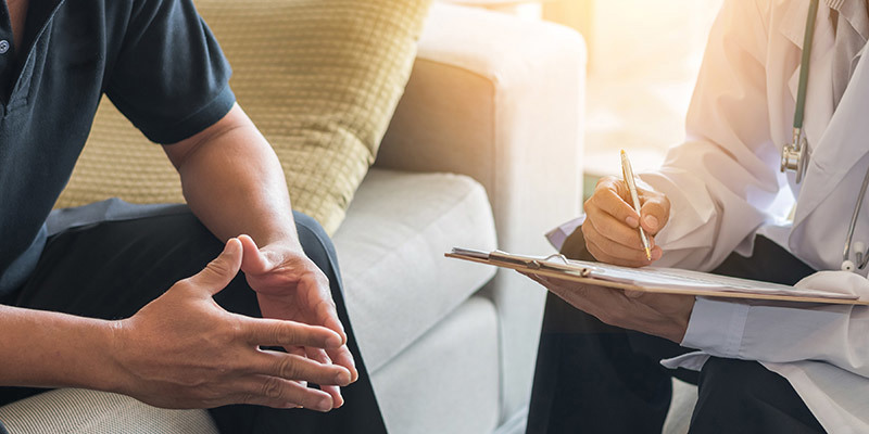 An employee and a manager conducting a sickness absence meeting